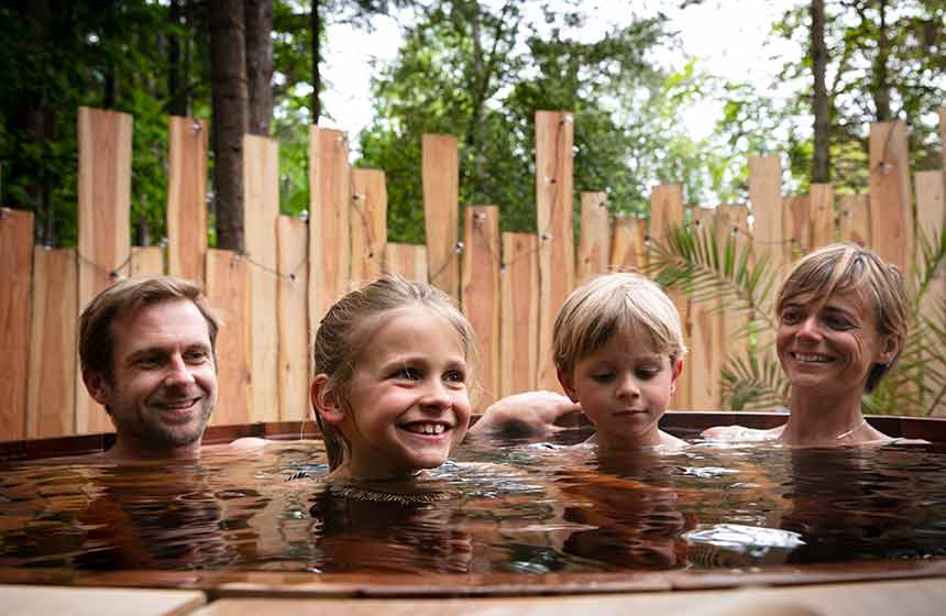 Family time at its best in the Nordic eco hot tub at Bain de Forêt