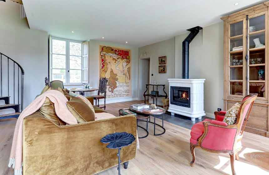 The sitting room is all the more relaxing for its woodburner