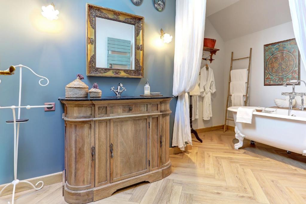 The chic bathroom contains a classic claw-footed freestanding bathtub 