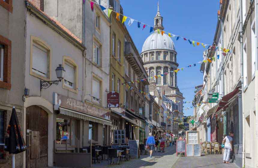 Visit Boulogne sur Mer for its seafood restaurants, its markets and the cobbled streets of its fortified town