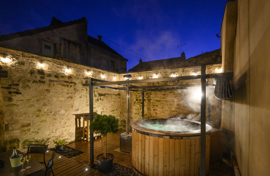 Enjoy rest and relaxation in the Nordic hot tub at Gite la Grange near Laon and Reims