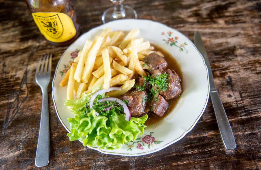 Tasting the local dish Carbonnade-Flamande (beer and beef stew) in an ‘estaminet’ (traditional inn) is an absolute must during your weekend break