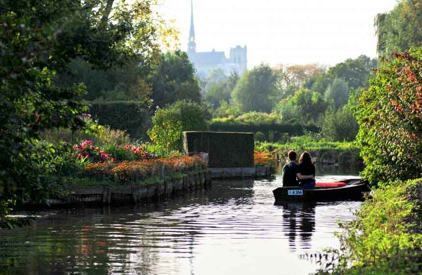 Hire a boat to explore Amiens' unique floating gardens, known as the 'Hortillonnages'