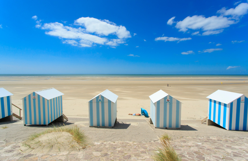 The beach at Hardelot surrounded by its adorable white and blue beach huts