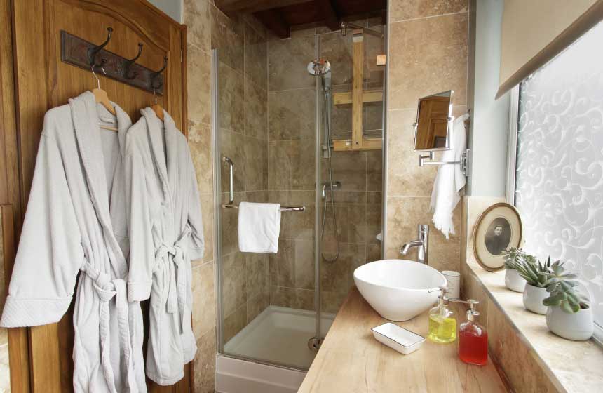 The hotel-standard luxury shower room complete with robes at your holiday cottage in Northern France
