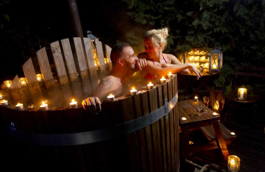 Guests can’t wait to try out the Nordic spa on their gypsy caravan holiday ‒ effectively a hot tub but wooden so blending more seamlessly with nature