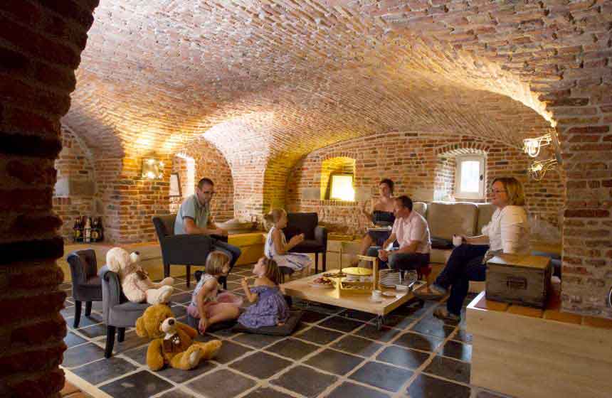 One of the best features of Manoir-du-Bolgaro in Northern France is the amazing lounge in the vaulted cellar, making it the perfect place to hold a large family weekend break