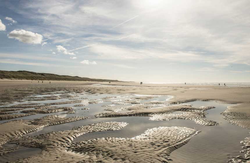 Hand in hand walks on the beach in Le Touquet