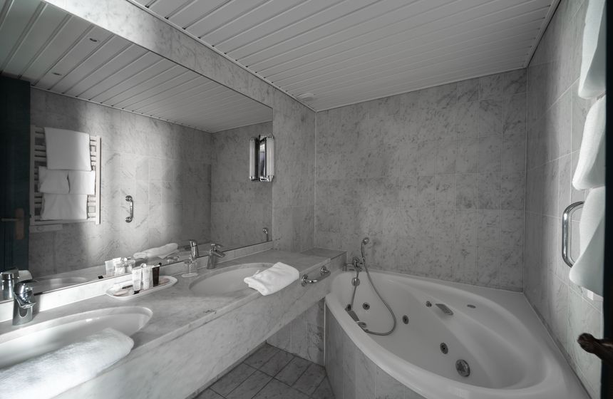 A junior suite bathroom at the Carlton Hotel in Lille comes complete with spa bath