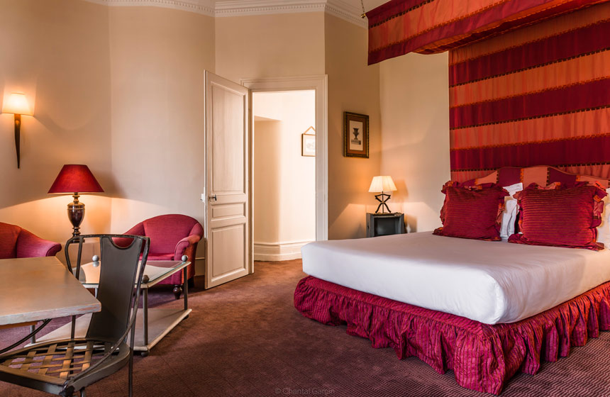 The red room at Château de Tilques in Northern France – perfect for your luxury French château holiday