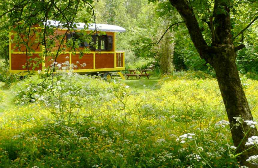 The cosy gypsy caravan at Maison de l’Omignon is a wonderfully unusual place to stay in France, right on the banks of the river