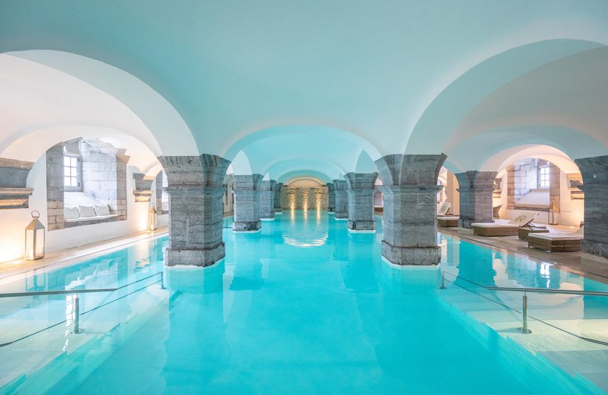 Enjoy the pool's serene blue waters at the Royal Hainaut Hotel & Spa in Valenciennes 