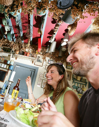 A sociable atmosphere and carbonade flamande (a beef stew) in a typical estaminet.