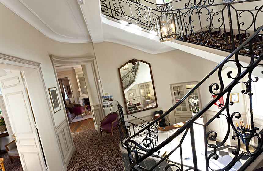 A stunning sweeping staircase sets the scene from the moment you set foot in Chateau Cléry