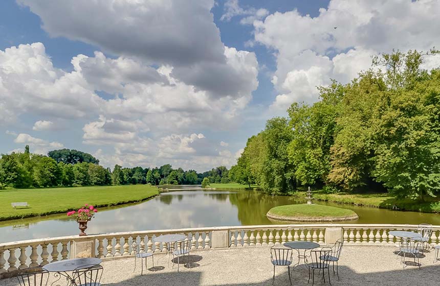 Enjoy a stunning view of the park from the terrace at Chateau d'Ermenonville