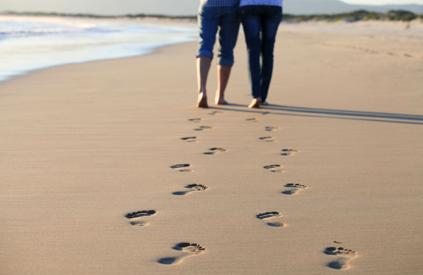 Walking barefoot on the fine sandy beach in Le Touquet on the coast of Hauts de France