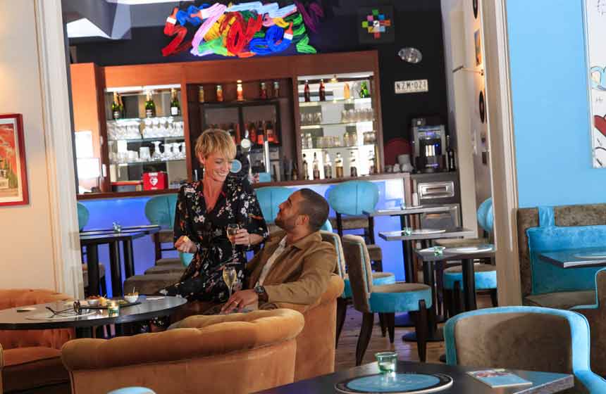 Enjoying a drink in the lounge-bar at Hotel Castel Victoria, Le Touquet, Northern France