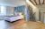 The warm and inviting bedroom upstairs complete with luxury linen bedding
