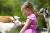 Children will enjoy helping to feed the animals near Villa des Groseilliers gite