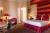 The red room at Château de Tilques in Northern France – perfect for your luxury French château holiday